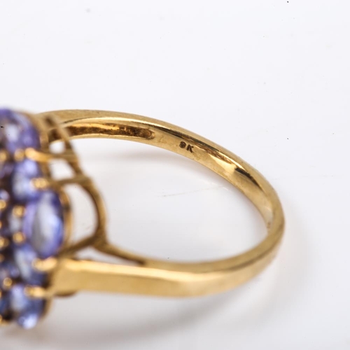 413 - A modern 9ct gold tanzanite cluster ring, set with oval mixed and round cut tanzanites, setting heig... 