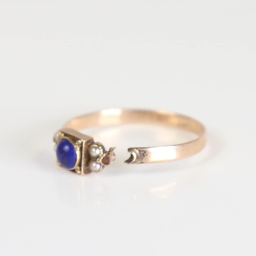 415 - A Georgian lapis lazuli and split pearl ring, set with cabochon lapis within a closed back unmarked ... 