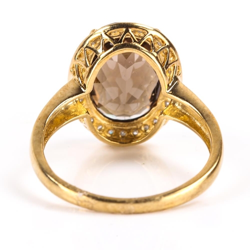 418 - A modern 9ct gold smoky quartz and diamond cluster ring, set with oval rose cut quartz and single cu... 