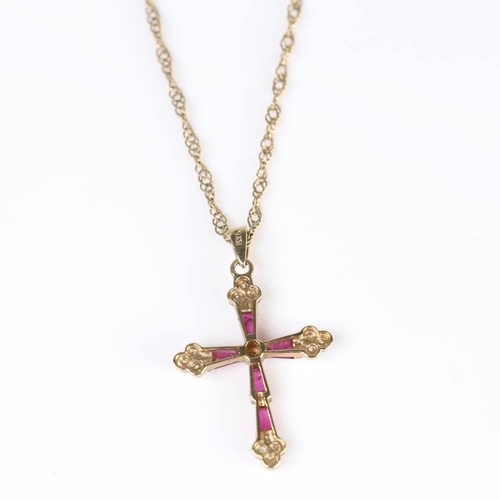 419 - A modern 9ct gold ruby and diamond cross pendant necklace, set with tapered baguette rubies and sing... 