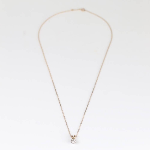 422 - A modern 9ct gold 0.25ct solitaire diamond pendant necklace, illusion setting with modern round bril... 