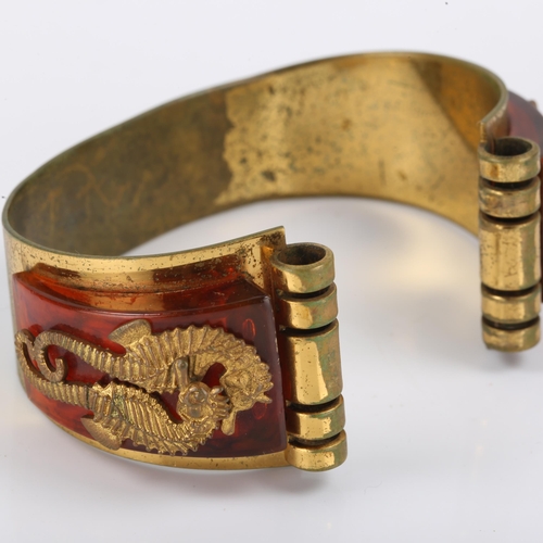 434 - JEAN PAINLEVE - a French Art Deco gilt metal and bakelite Seahorse demi-parure, comprising cuff brac... 