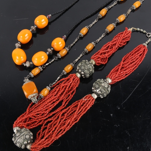 436 - 3 Eastern stone set necklaces, including coral and amber, unmarked white metal settings (3)