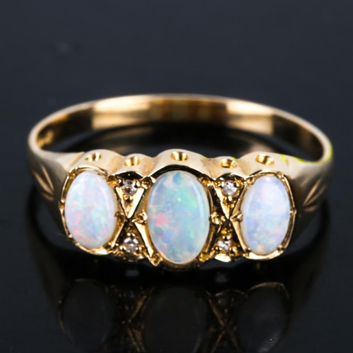 439 - A late 20th century 9ct gold 7-stone opal and diamond half hoop ring, set with oval cabochon opals a... 