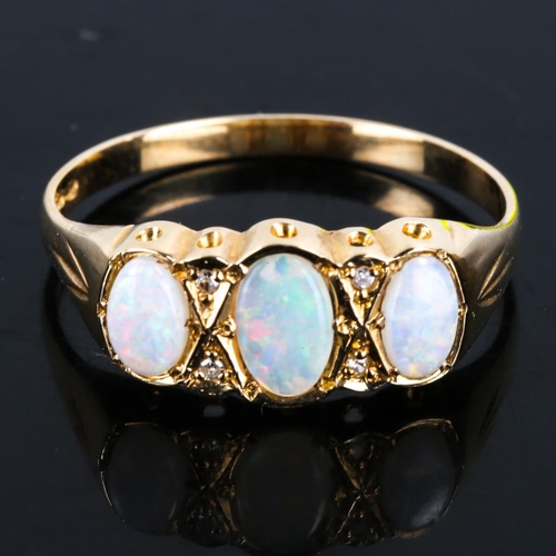 439 - A late 20th century 9ct gold 7-stone opal and diamond half hoop ring, set with oval cabochon opals a... 