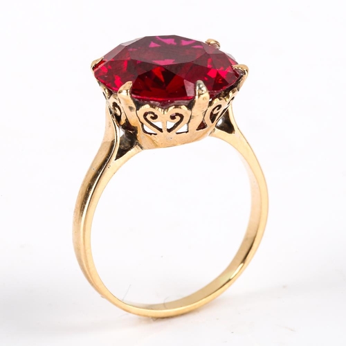 440 - A late 20th century Middle Eastern 14ct gold synthetic ruby dress ring, claw set with large round cu... 