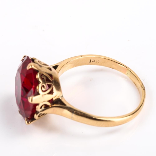 440 - A late 20th century Middle Eastern 14ct gold synthetic ruby dress ring, claw set with large round cu... 