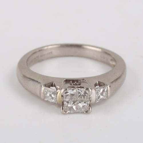 441 - A modern platinum diamond cluster ring, set with Princess cut diamonds, total diamond content approx... 