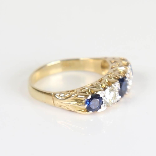 444 - A large 18ct gold 5-stone sapphire and diamond half hoop ring, set with round cut sapphires and roun... 