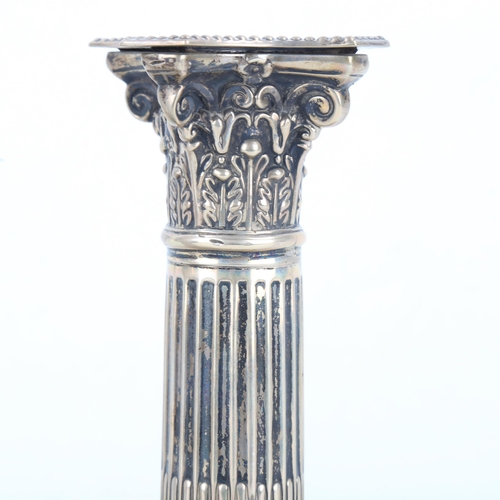 453 - A pair of Edwardian silver Corinthian column table candlesticks, with removable sconces, by James Ch... 