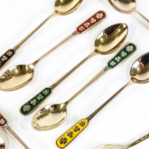 458 - EGON LAURIDSEN - a set of 12 Danish vermeil sterling silver and harlequin enamel coffee spoons, with... 