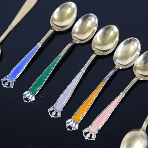 459 - A set of 7 Scandinavian vermeil sterling silver and harlequin enamel coffee spoons, with crown termi... 