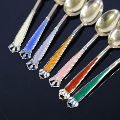 459 - A set of 7 Scandinavian vermeil sterling silver and harlequin enamel coffee spoons, with crown termi... 