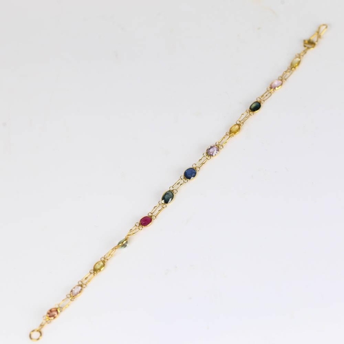 619 - A modern handmade 14ct gold vari-hue sapphire line bracelet, set with oval mixed cut sapphires, brac... 