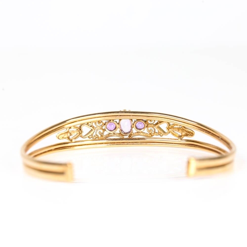 630 - A late 20th century 9ct gold amethyst cuff bracelet, pierced openwork settings with oval mixed and r... 