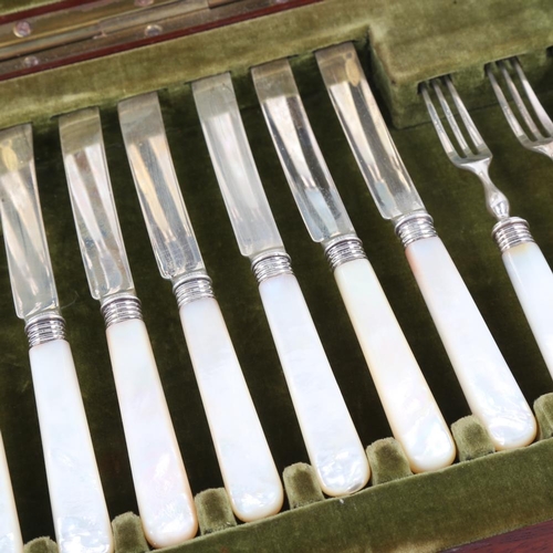 631 - An Edwardian silver-bladed mother of pearl handled dessert cutlery set for 12 people, by Elkington &... 