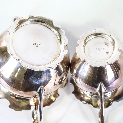 635 - An Edwardian silver matching sugar bowl and cream jug, bulbous form with cast floral rim, by Martin,... 