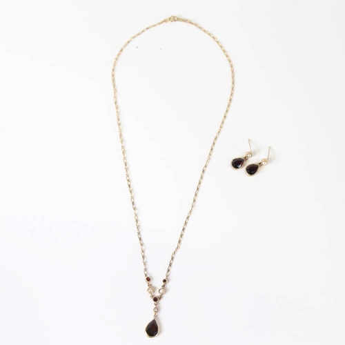 640 - A modern 9ct gold garnet and split pearl demi-parure, comprising drop necklace and pair of drop stud... 