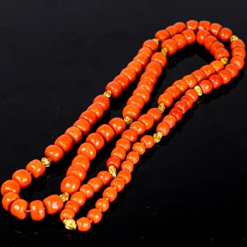 647 - A large graduated single strand polished coral prayer bead necklace, with unmarked high carat gold s... 