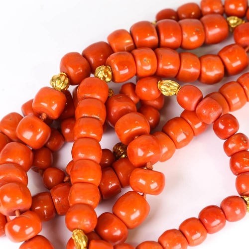 647 - A large graduated single strand polished coral prayer bead necklace, with unmarked high carat gold s... 