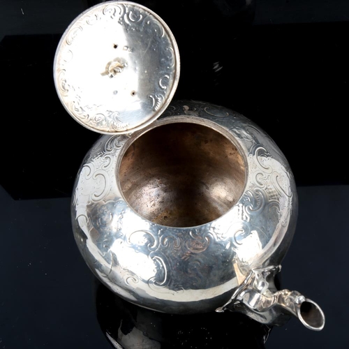 648 - A Victorian silver melon teapot, circular form with engraved foliate decoration, scrolled handle wit... 