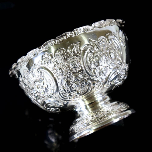 654 - *WITHDRAWN* An Edwardian silver pedestal fruit bowl, relief embossed foliate decoration, by Goldsmit... 