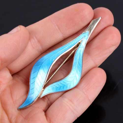 666 - FINN JENSEN - a Norwegian stylised vermeil sterling silver and blue enamel leaf brooch, brooch lengt... 