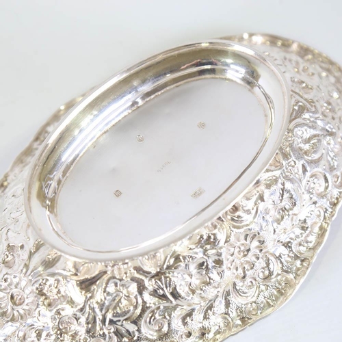 667 - *WITHDRAWN* A late Victorian Scottish silver pedestal cake basket, oval form with allover relief emb... 