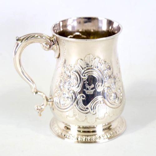 675 - *WITHDRAWN* A George II silver pint mug / tankard, relief embossed foliate decoration with scrolled ... 