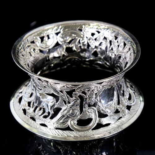 676 - An Edwardian Irish silver dish ring, pierced and relief embossed farmyard scene, by James Wakely and... 