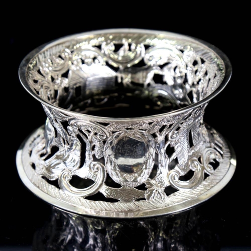 676 - An Edwardian Irish silver dish ring, pierced and relief embossed farmyard scene, by James Wakely and... 