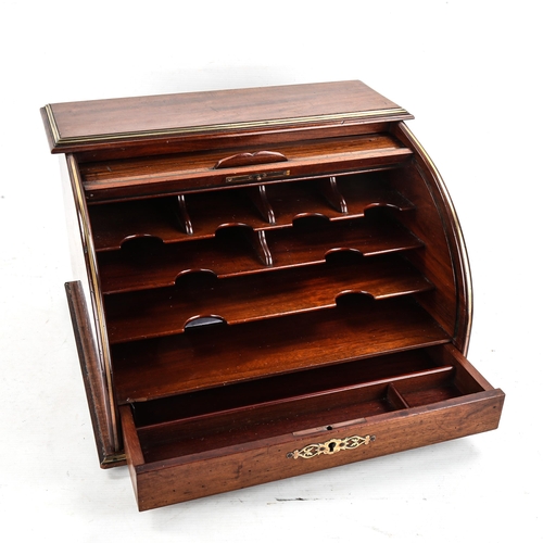 1003 - A mahogany tambour-front desktop stationery cabinet, circa 1900, with applied brass banding and draw... 