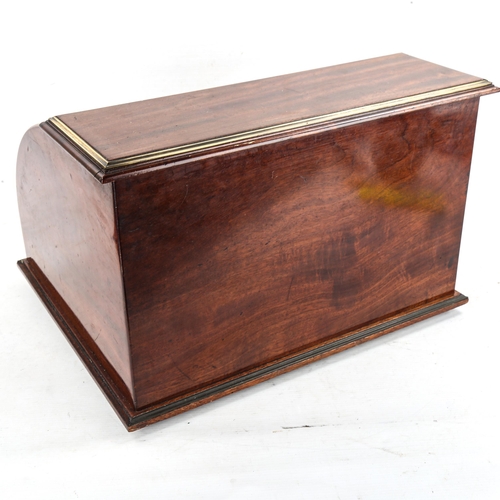 1003 - A mahogany tambour-front desktop stationery cabinet, circa 1900, with applied brass banding and draw... 