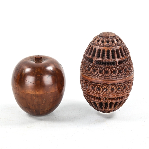 1018 - A miniature turned wood apple, containing a miniature domino set, height 4.5cm, and a carved and pie... 