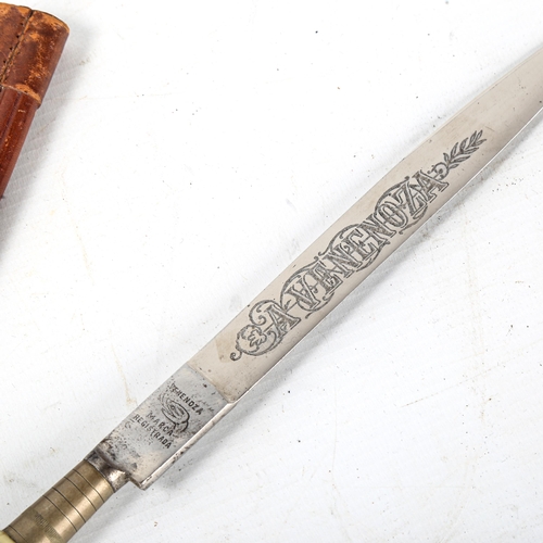 1054 - A Vintage Gaucho knife, blade engraved Venenoza, composition handle with leather scabbard, length 32... 