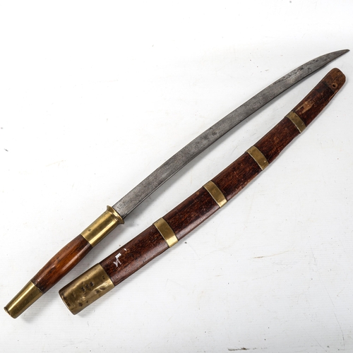 1057 - An Oriental sword, possibly Burmese, with brass bands and mounts, blade length 55cm