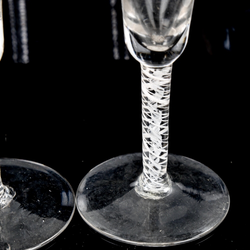 1064 - 2 similar 18th century cordial glasses, with milk twist stems, height 15.5cm