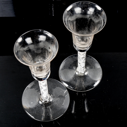 1064 - 2 similar 18th century cordial glasses, with milk twist stems, height 15.5cm