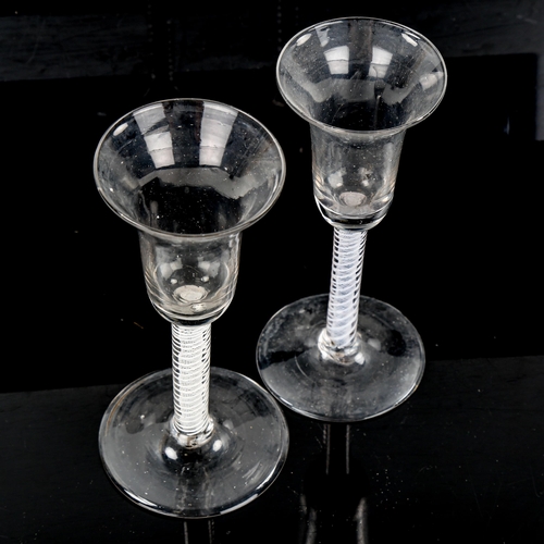 1067 - 2 similar 18th century cordial glasses, with milk twist stems, height 16.5cm