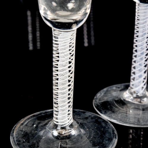 1067 - 2 similar 18th century cordial glasses, with milk twist stems, height 16.5cm