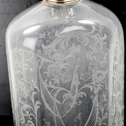 1082 - An Antique Continental handblown etched glass spirit bottle, a Continental silver top with engraved ... 