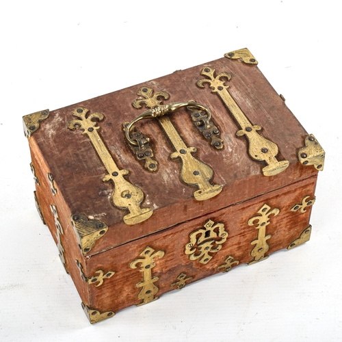 1084 - A Victorian brass-bound velvet-covered casket, with brass carrying handle, 21cm x 13.5cm x 12cm