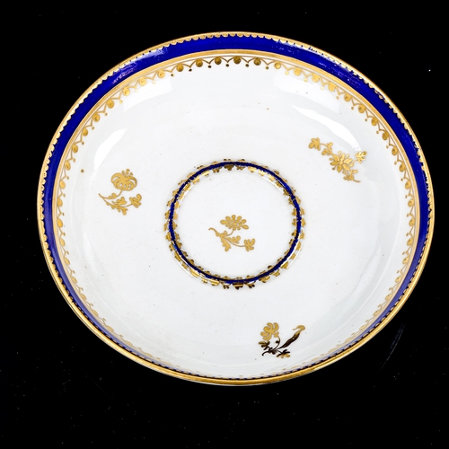 1086 - Crown Derby 2-handled cup and saucer, with blue and gilt decoration