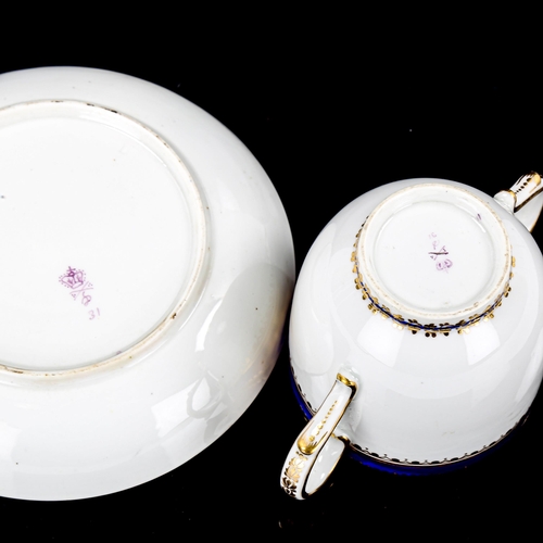 1086 - Crown Derby 2-handled cup and saucer, with blue and gilt decoration