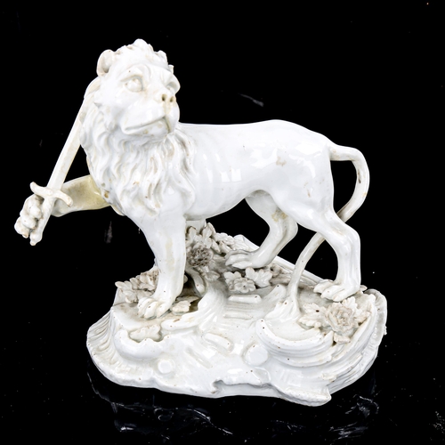 1087 - A Continental white glaze porcelain figure of a heraldic lion holding a sword, height 13cm, and a wh... 