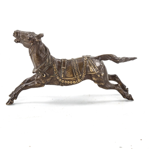 1090 - A Russian patinated bronze galloping horse in harness, unsigned, late 19th/early 20th century, lengt... 