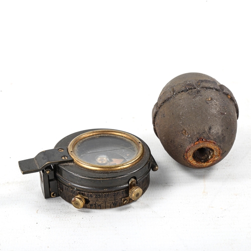 1104 - A Great War German egg grenade, circa 1917 (inactive), length 5.5cm, and a military trench compass (... 