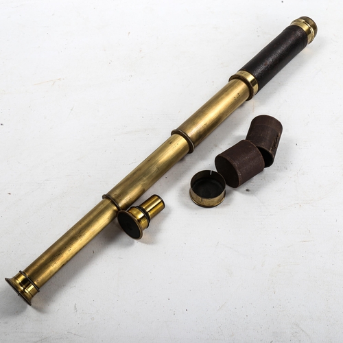 1118 - A small leather-bound brass 3-draw pocket telescope, lens diameter 2.5cm, length opened 42cm, with s... 