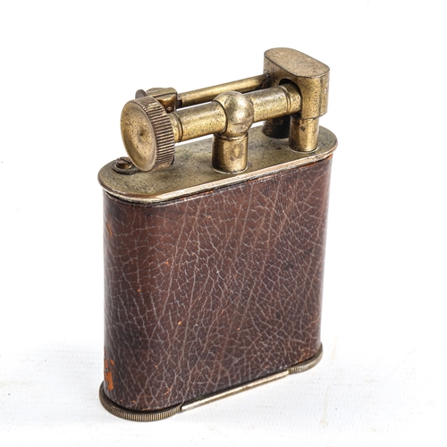 1125 - A Vintage Goliath cigar lighter, nickel plate brass body with leather covering, and enamelled pennan... 