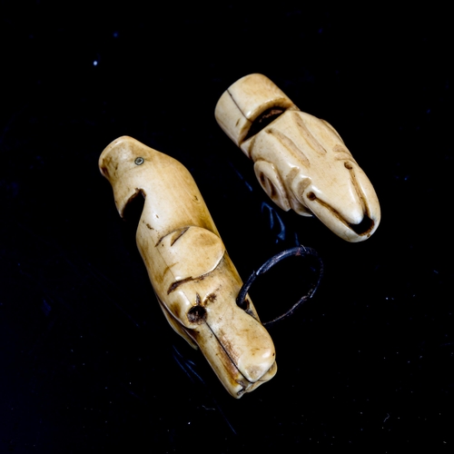 1136 - 2 Antique carved bone dog's head design whistles, 18th or 19th century, length 5.5cm and 4cm